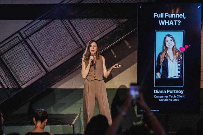 Diana Portnoy speaking on stage